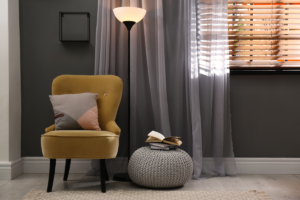 A window with layered drapery and blinds