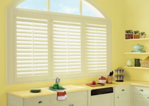 Palm Beach™ Polysatin™ Vinyl Shutters are ideal kitchen window treatments.
