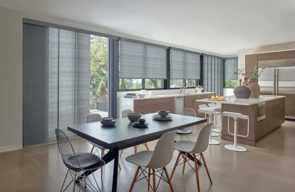 Skyline® Panel-Track Blinds on sliding glass doors in the dining area. 