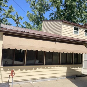 Custom awning by Mr. K's Fabric Shop in Quincy, IL, showcasing 50+ years of experience in window treatments and upholstery.