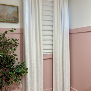 Elegant white curtains from Mr. K's Fabric Shop in Quincy, IL, showcasing custom window treatments with 50+ years of expertise.